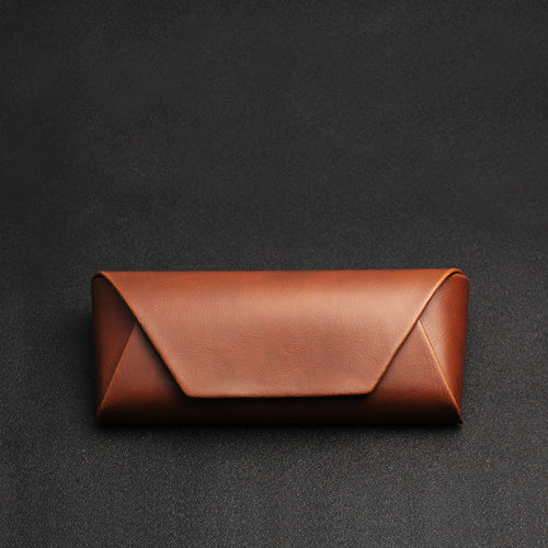 Brown PU fold-over glasses case, closed, showing the envelope flap