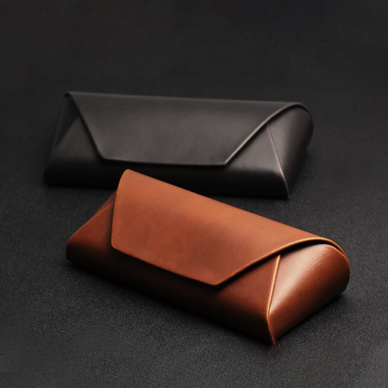 Brown and black PU fold-over glasses cases shown together