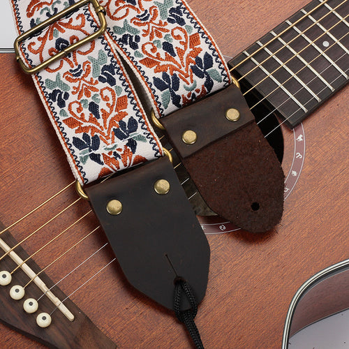 Woven jacquard guitar strap on an acoustic guitar