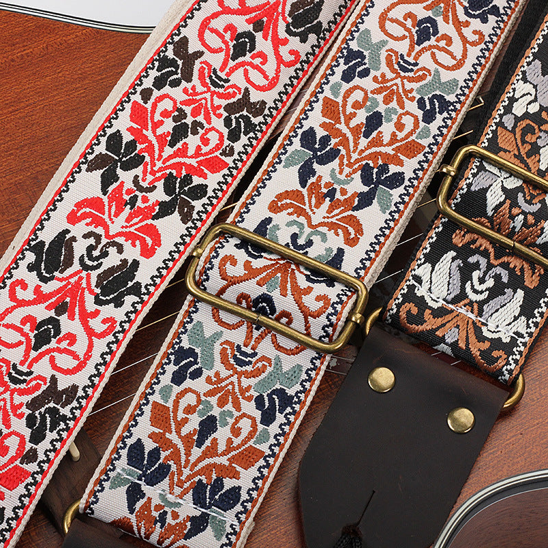 Close-up of the jacquard weave and distressed brown end tab with brass-tone rivets