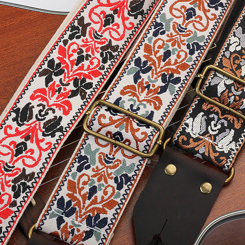 Close-up of the jacquard weave and distressed brown end tab with brass-tone rivets
